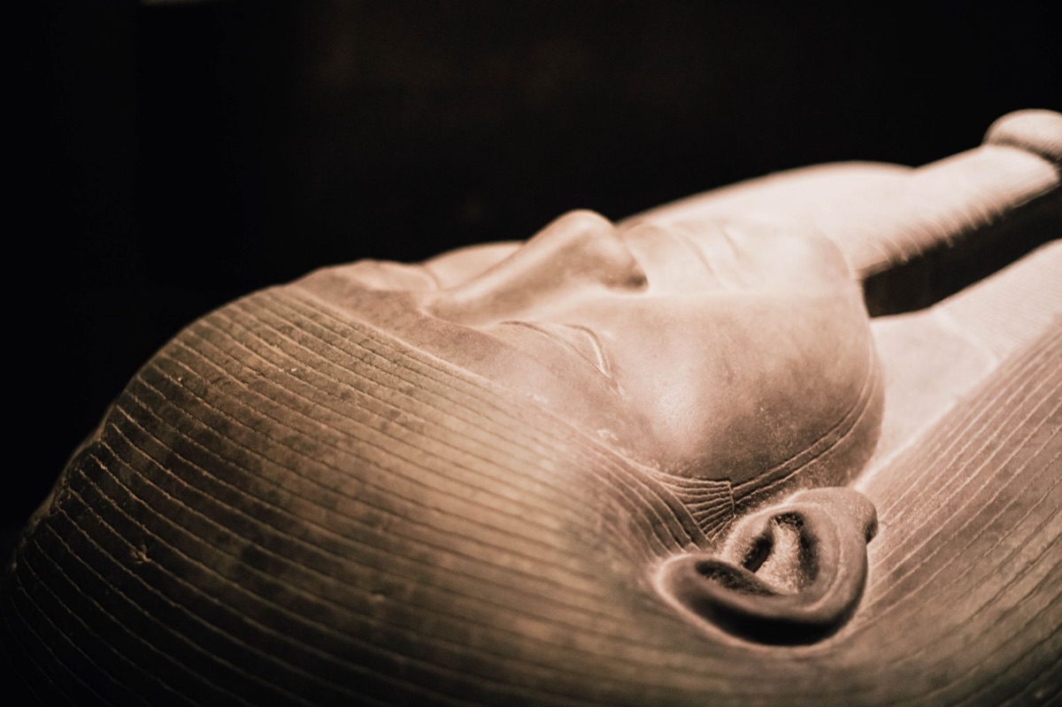 Golden mask of Tutankhamun in tomb interior
