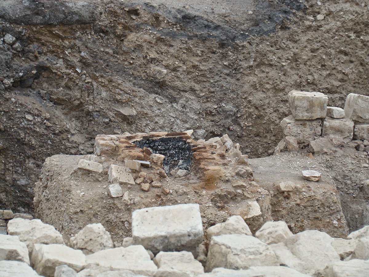 Ancient Egyptian tomb excavation site with artifacts