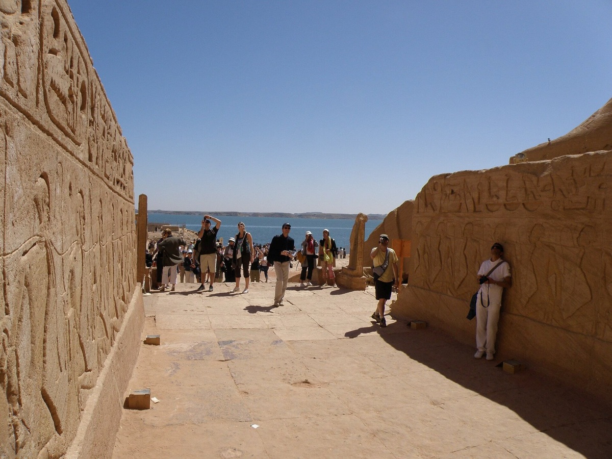 Wide shot of Abu Simbel temple entrance with intricate carvings and architectural detail