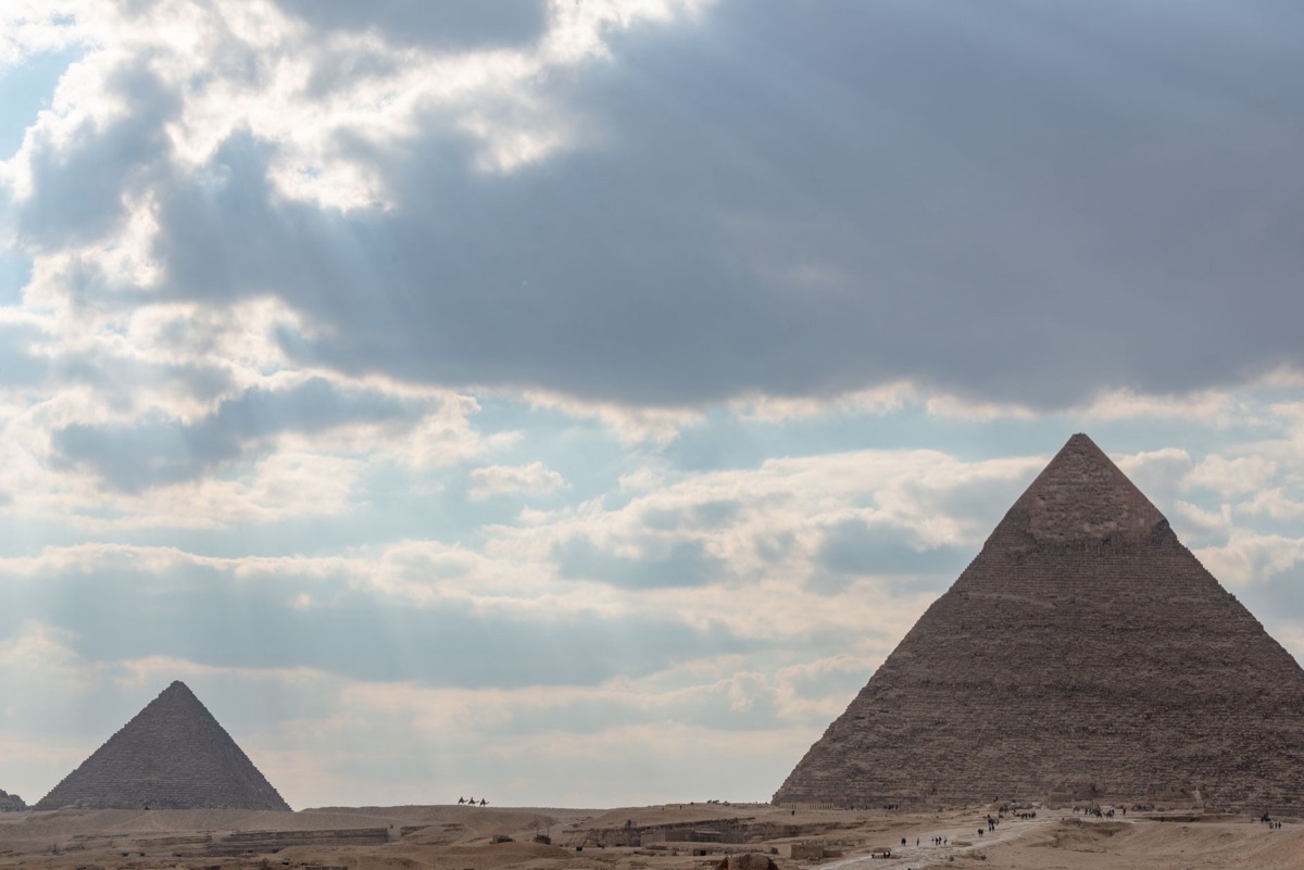 Ancient Egyptian pyramid with sun rays