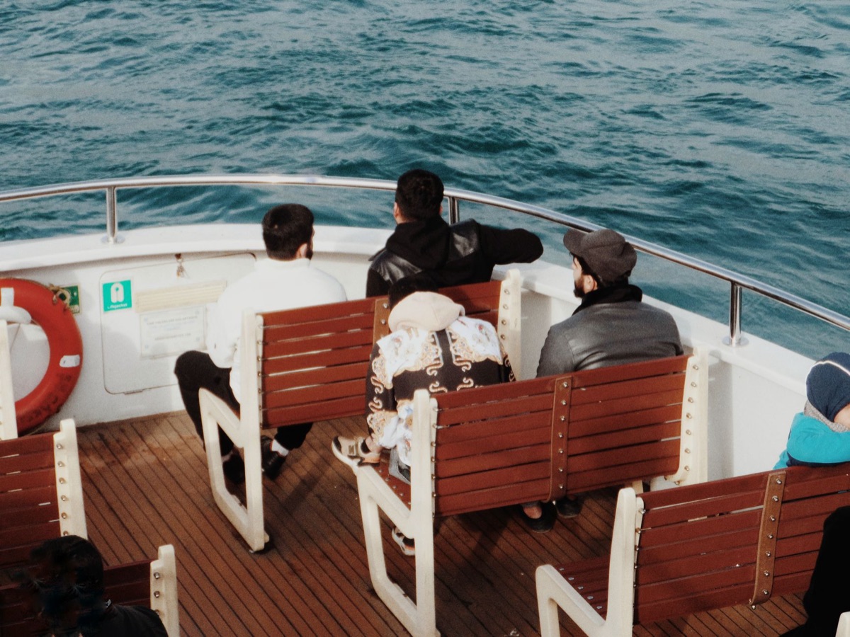 Nile cruise passengers on deck enjoying the view