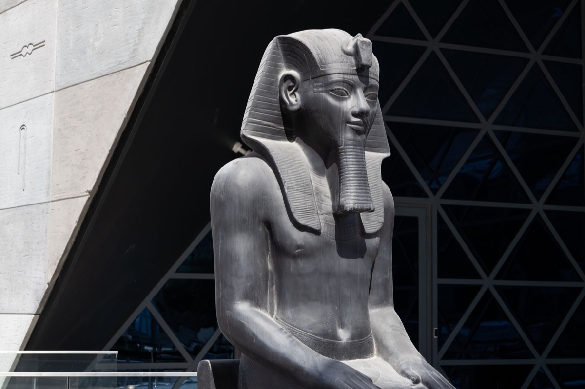 Tutankhamun statue in a museum display case