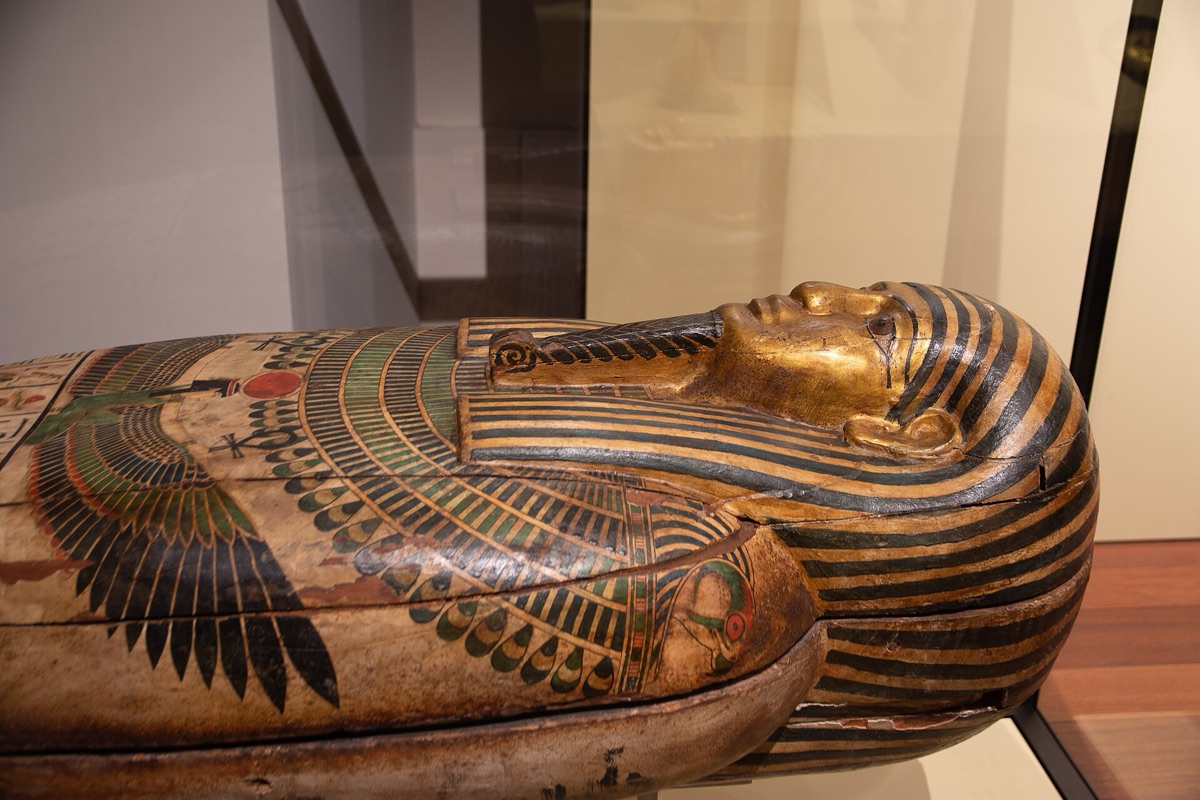 Ancient Egyptian sarcophagus with golden detailing