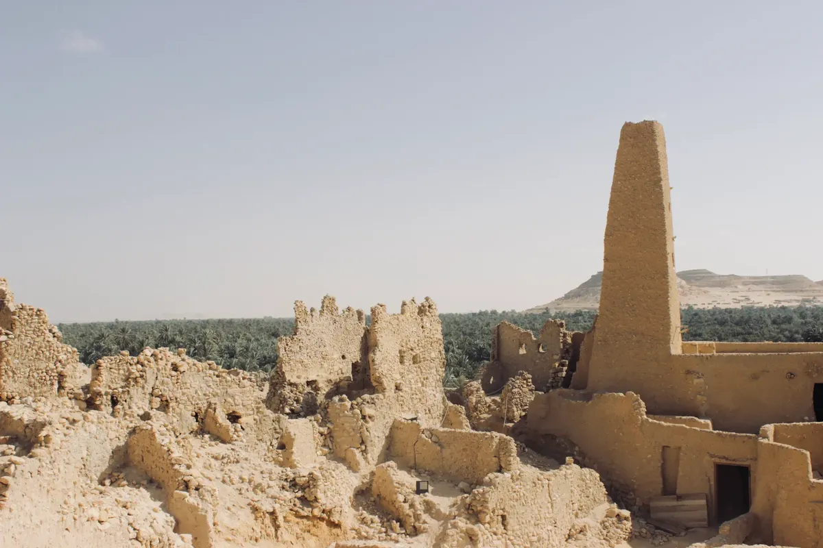Explore the ancient ruins of an oracle temple amidst Egypt's arid landscape in Matrouh Governorate.